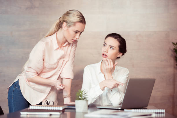 istock businesswomen working together with laptop 688005356