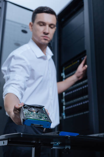 istock Hard drive being taken by a professional technician 688005422