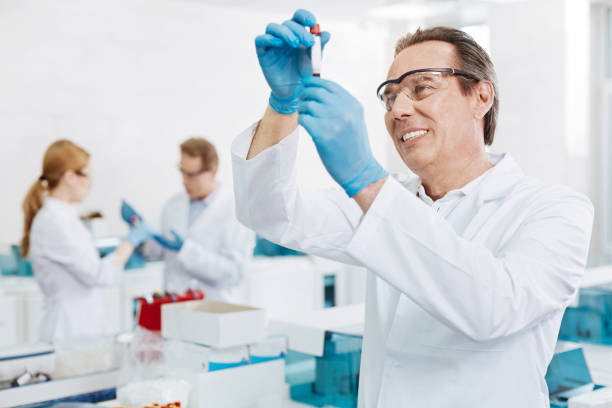 istock Positive delighted scientist standing in semi position 688008776