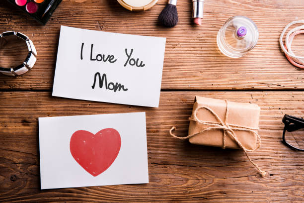istock Mothers day composition. Paper notes, gift and beauty products. 688012540