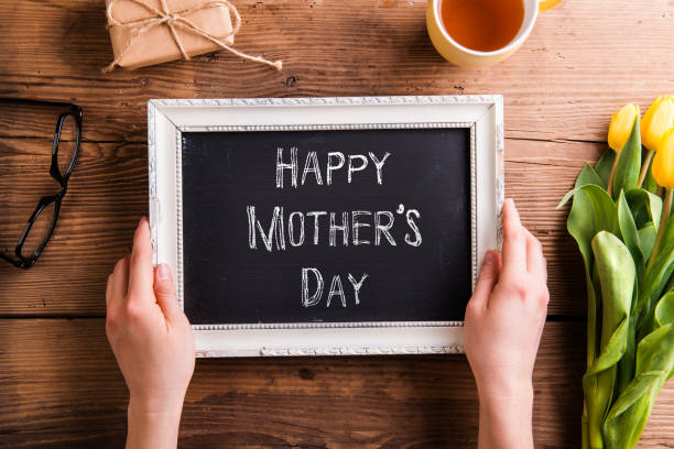 istock Mothers day composition. Picture frame with sign, studio shot. 688012786