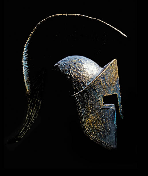 istock Ancient greek Sparta type helmet isolated on a black background 688015664