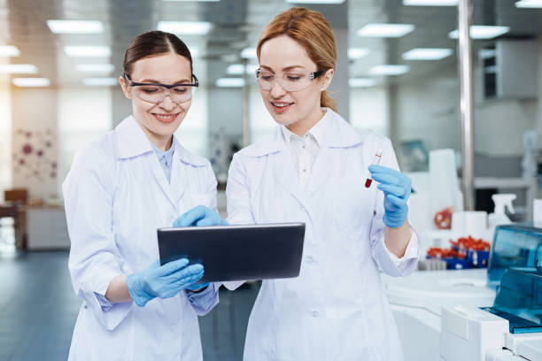 istock Two colleagues looking at screen of the tablet 688015754