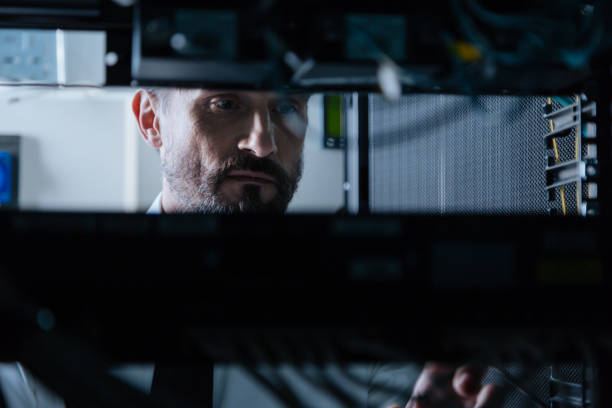 istock Serious male technician focusing on his job 688015958