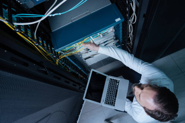 istock Top view of a technician holding a laptop 688018924