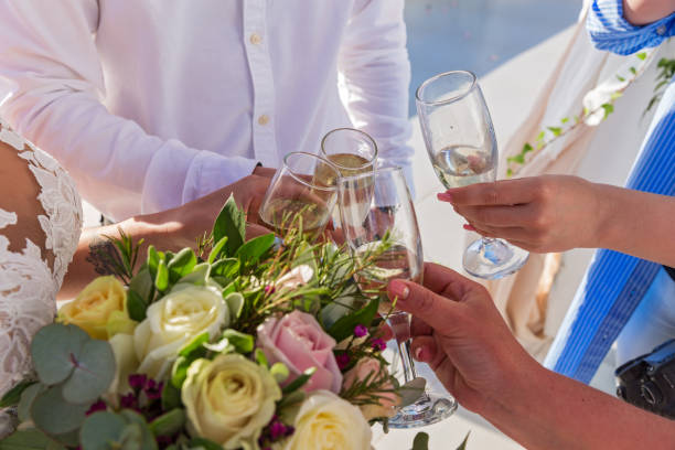 istock Flowers and wine glasses in the hands 688021842