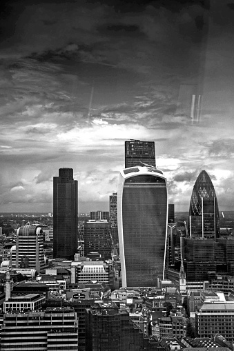 Double exposure extravagantly toned image of London city center skyline