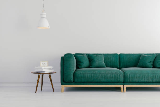 istock 3d render of beautiful interior with green sofa and white walls 688022634