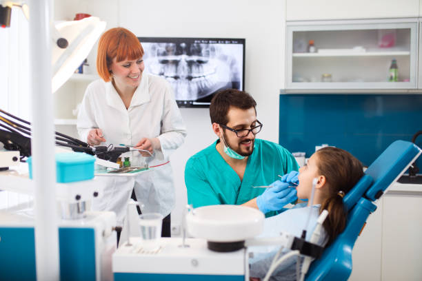 istock Little girl at dentist's office having routine checkup. 688022666