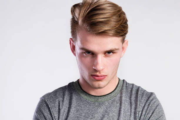 istock Young handsome hipster man in gray t-shirt, studio shot. 688023256