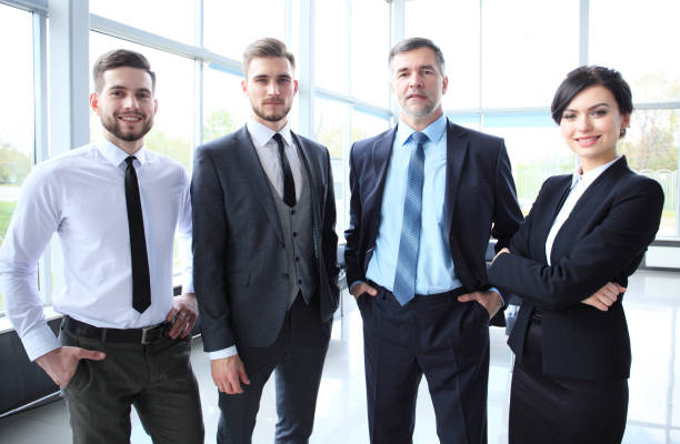 istock Happy smiling business team in office 688025318
