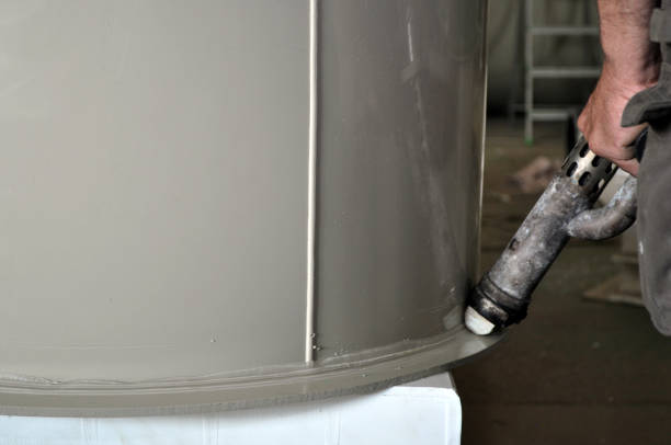 istock Big cylindrical custom made plastic tank in the process of polishing 688030170