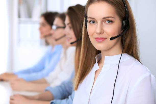 istock Call center operator.Young beautiful business woman in headset. 688036920