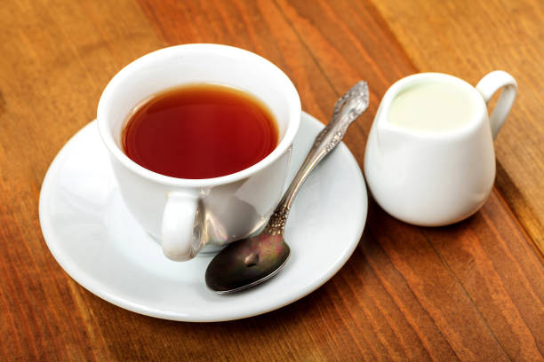 istock Cup of tea and jug with milk 688037960