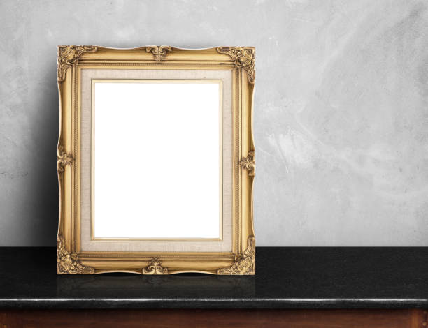 istock Blank Gold victorian picture frame on black marble 688038266