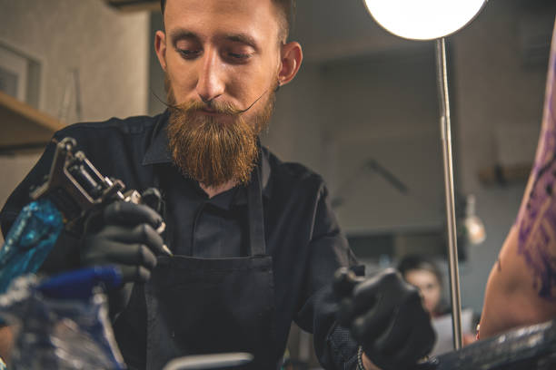 istock Pensive man looking at instrument in salon 688041066
