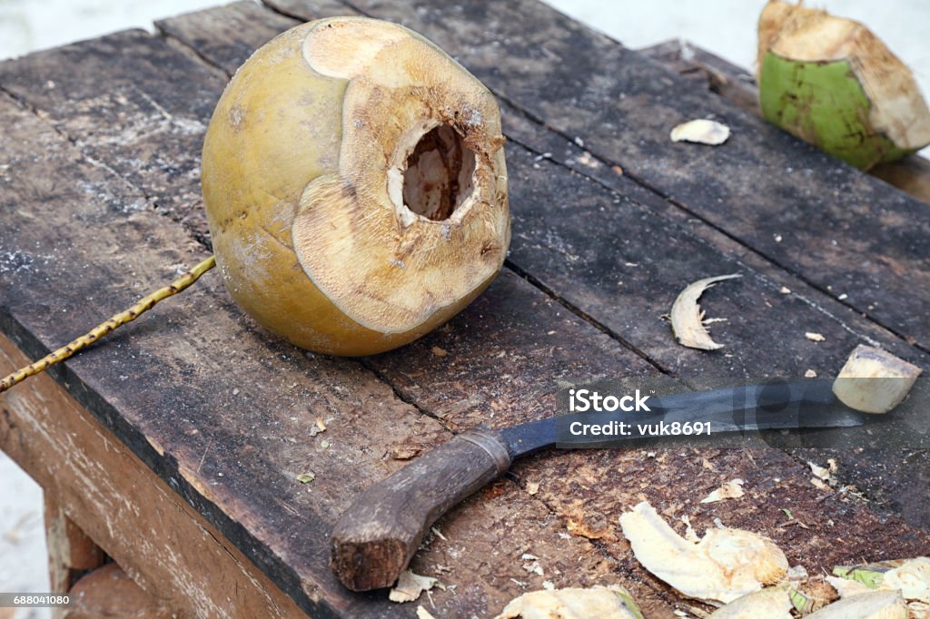 Exotic meal Table with coconut and a knife for cutting Asia Stock Photo