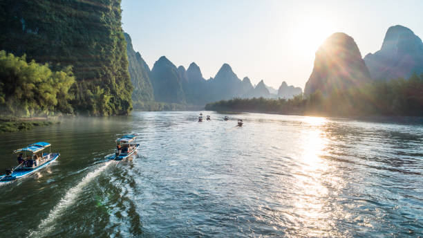 istock bamboo boat moving at Li River during sunset time 688046606