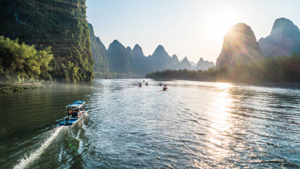 istock bamboo boat moving at Li River during sunset time 688046650