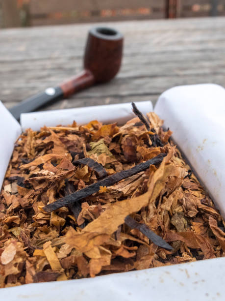 istock Pipe tobacco in open box and pipe in the background 688050202