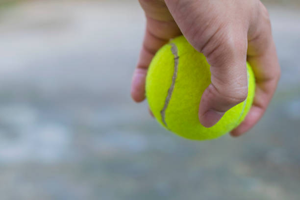 istock Tennis ball hold in hand 688050732