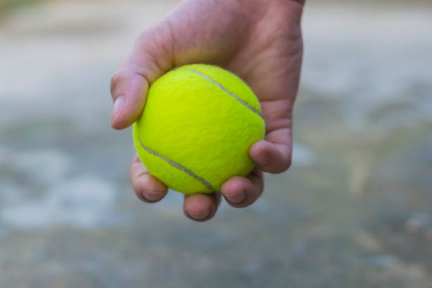 istock Tennis ball hold in hand 688050952