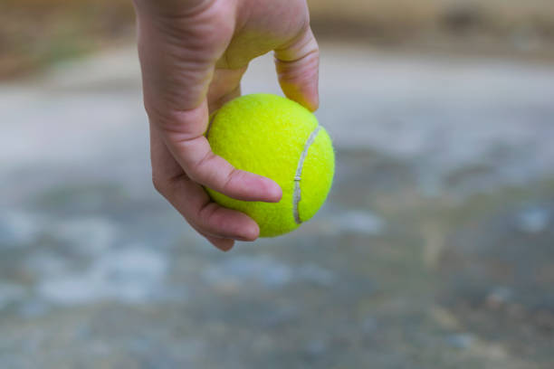 istock Tennis ball hold in hand 688052868