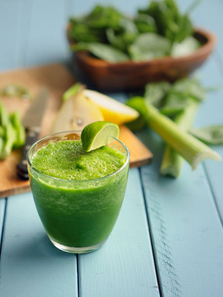 Healthy cucumber,celery spinach and pear smoothies stock photo