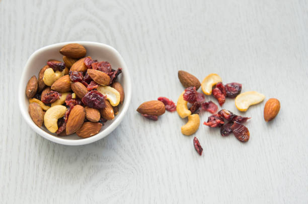 Healthy mix nuts on wooden background.
