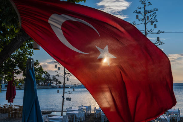 istock Turkish flag waving and sun shining behind in Datca 688068194