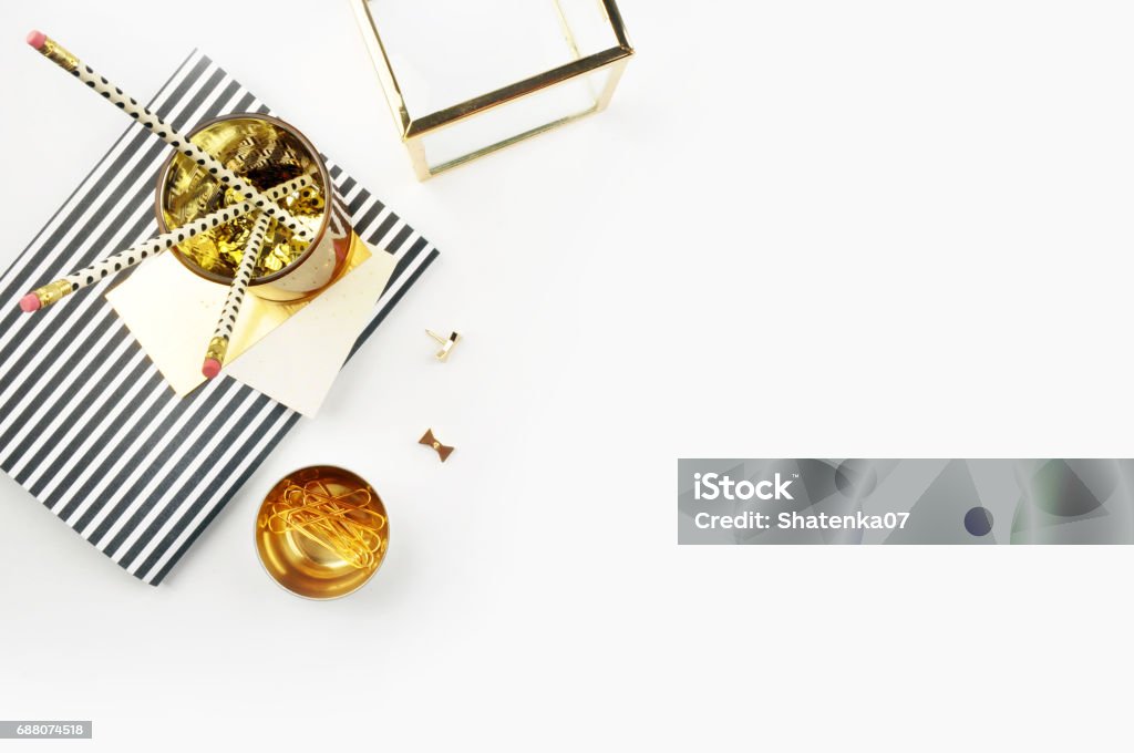 Header website or Hero website, view table gold accessories office items. Flat lay. Feminine workspace. Arts Culture and Entertainment Stock Photo