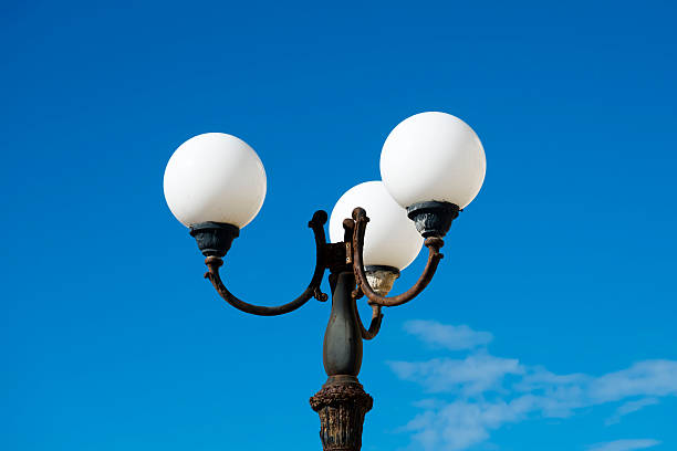 istock Low Angle View Of Street Light Against Blue Sky 688074959