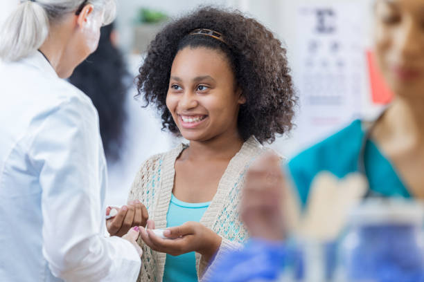 istock Pretty African American patient discusses something with physician 688085890
