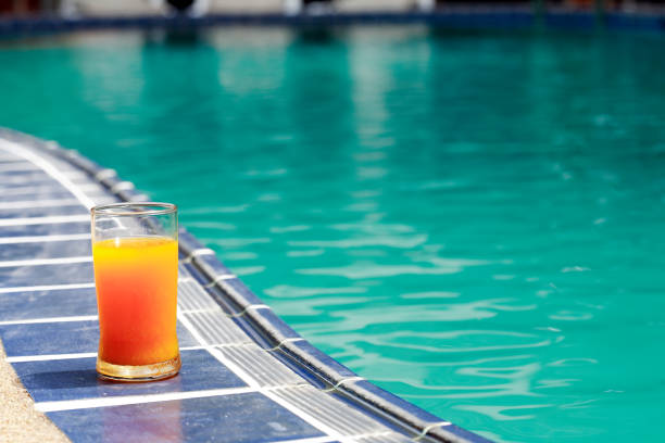 istock Orange Juice Near Water Pool 688090410