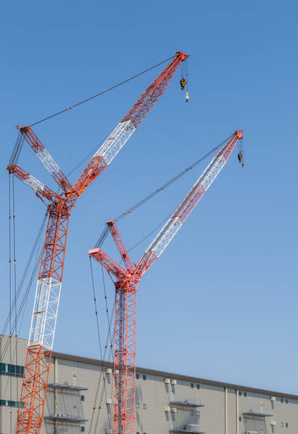istock Close - up big red crane at construction site 688095522