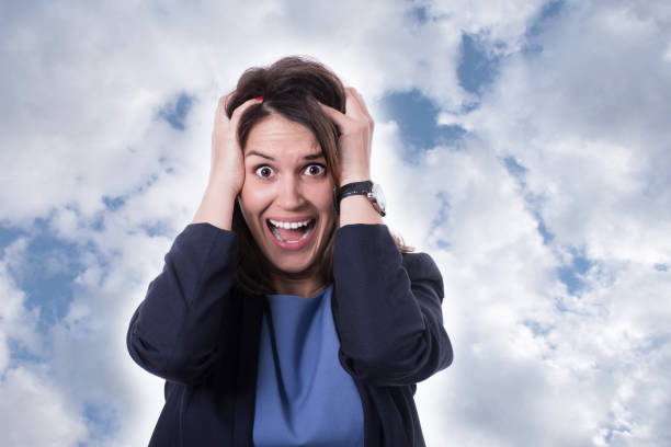 istock Woman stressed is going crazy pulling her hair in frustration. 688095536
