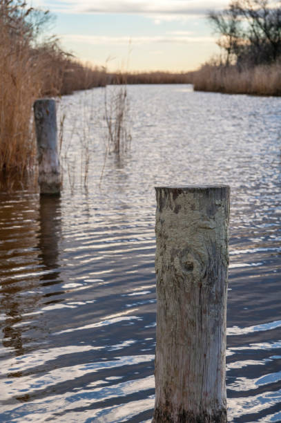 Canal on a lake Canal on a lake bollard pier water lake stock pictures, royalty-free photos & images