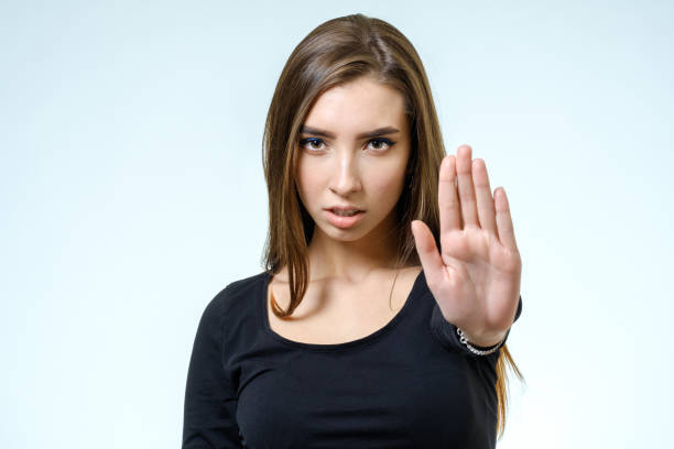 istock Young woman making rejection pose on white background 688107384