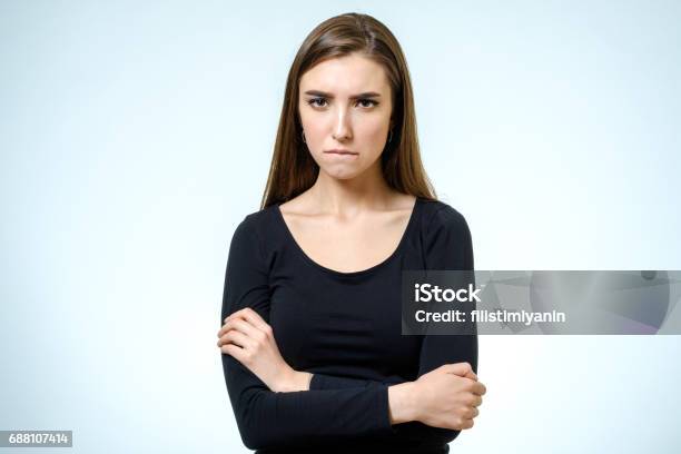 Young Upset Woman Isolated On White Background Studio Shot Stock Photo - Download Image Now