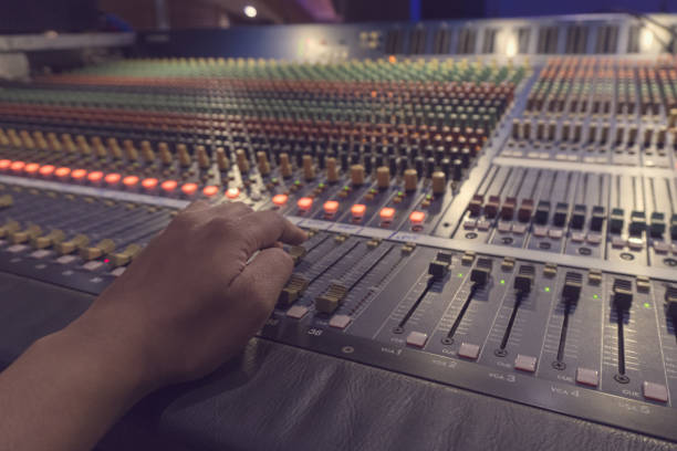 istock close up hand adjust audio mixer 688117546