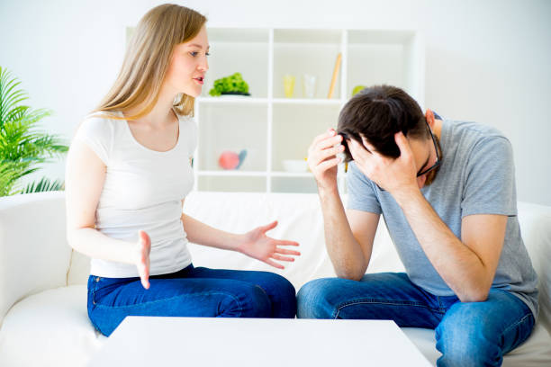 istock Loving couple swears on the sofa 688120256