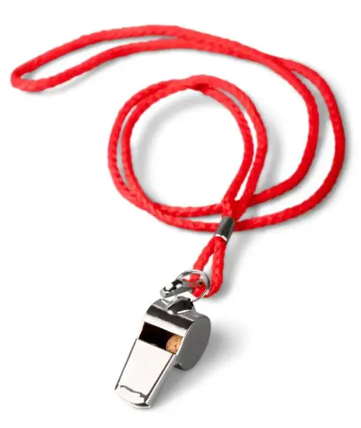Sports whistle with a lace. It is isolated on a white background