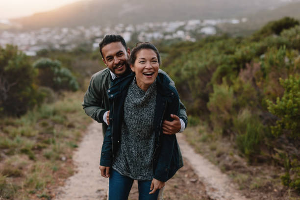 istock Happy young couple having fun on their countryside trip 688127468