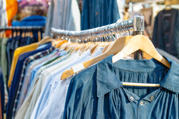 Rail of second-hand clothes on display at Old Spitalfields Market Rail of second-hand clothes on display at Old Spitalfields Market in London fashion bazaar stock pictures, royalty-free photos & images