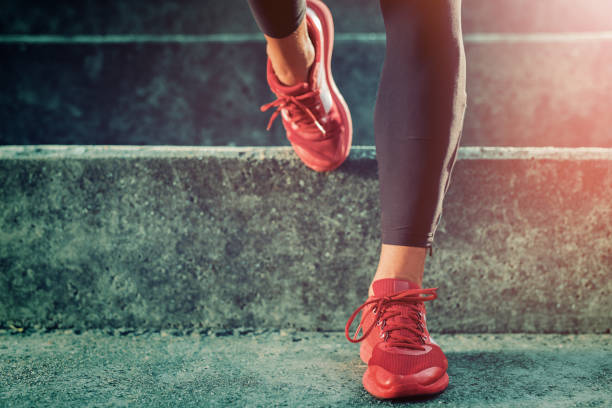 istock Close up image runner legs in running shoes 688132374