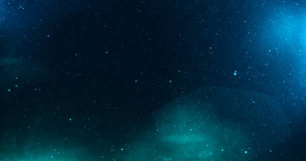 istock Universe with stars and deep blue and green light 688135212