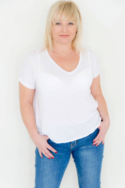 istock Woman in white stand inside empty room 688135746