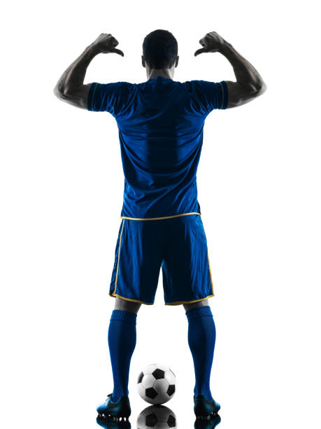istock soccer player man standing back  silhouette isolated 688143922