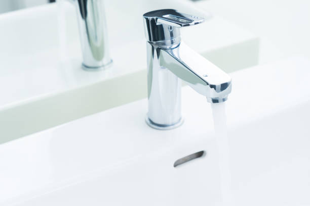 istock Iron tap with running water 688150990