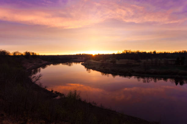 istock Spring. river. sunrise. sunset. Dawn over the river photographed in early spring 688157468